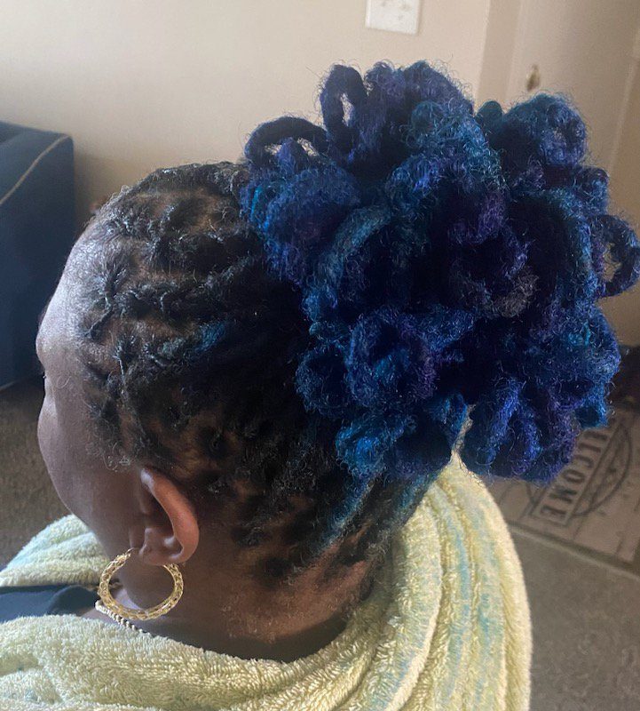 Blue loc updo styled by Keturah